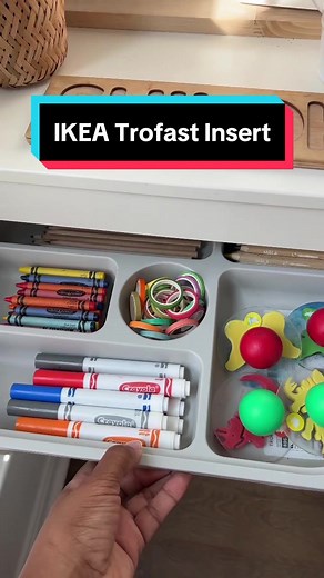 This $3 insert fits perfectly inside the IKEA Trofast unit. Perfect for storing arts and crafts supplies in a small playroom or shared family play space. #ikeahacks #ikeafinds #ikeafavorites #ikeatrofast #playroominspo #playroomgoals #playroomdecor
