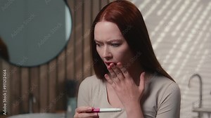 Pregnant Caucasian woman future mother female in home bathroom stressed sad confused girl check positive result unwanted pregnancy ovulation test scared anxious lady health problem fertility abortion