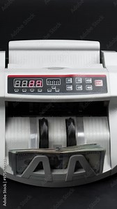 Vertical video. Close-up of a large sum of money being processed in a cash counting machine. Ideal for highlighting financial success, banking, and currency exchange services.