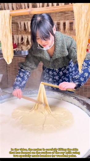 Peeling process in making dried bean curd sticks