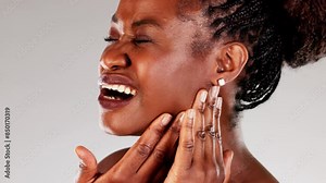 Focused African American Dentist Providing Treatment for a Young Woman
