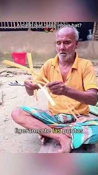 The artisan uses palm fronds to craft traditional agricultural palm-leaf hat. #HandsOnSkills #Diy