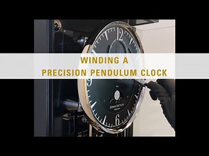 Winding a precision pendulum clock