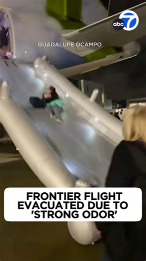 A Frontier plane was evacuated as a precaution during the boarding process when a strong odor was detected. Passenger video shows travelers coming down an emergency slide while others at the bottom help catch them. | ABC7