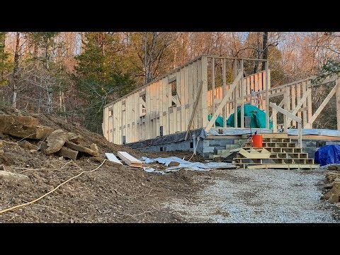Septic is all in, grading around house site and start of roof
