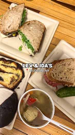 Michella Hand • Your Local Insider on Instagram: "If you’re in Hudson, NY, you have to stop at @levandidas inside the @cannonballfactory. A love letter to NYC Jewish, Italian, and Greek delis — and Hudson’s eclectic food scene. 🥪✨ Breakfast runs until 11:30am (iced coffee + the Easy Peasy and Wake & Schvitz are a must). For lunch, the pastrami is unreal and 100% worth the hype, and the Feel Good with turkey and pickles is pure comfort. Don’t skip the homemade pastries — baked fresh daily and se