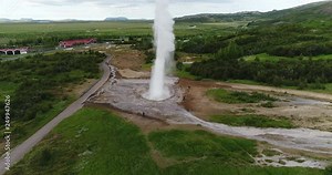 Iceland geyser drone aerial 4K video - Strokkur geyser aka Geysir. Famous Iceland tourist attraction and landmark on the Golden Circle.