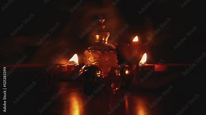 Diya lamp and oil with fire, smoke candles and color for celebration of Divaly festival of light