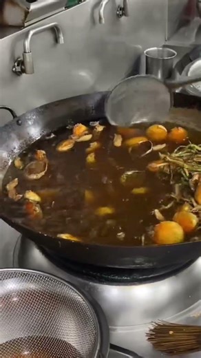 The process of making delicious food by a chef in a restaurant kitchen