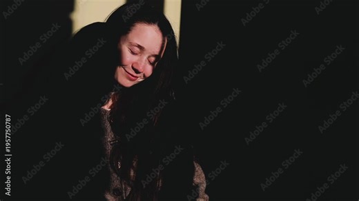 Slow motion of young white woman taking hot shower behind steamy glass. Cinematic aesthetic of self care morning routine. Water drops on foggy door, warm light, relaxing spa atmosphere at cozy home. M