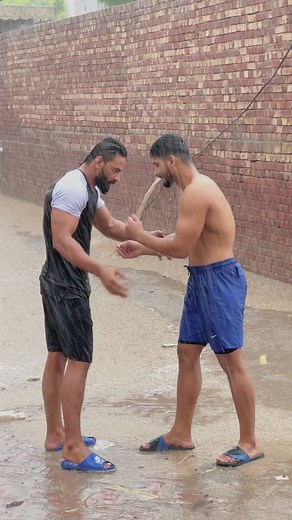 Shirtless Outdoor Wrestling Match Between Two Males