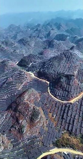 A large-scale solar farm built across mountain ranges in China
