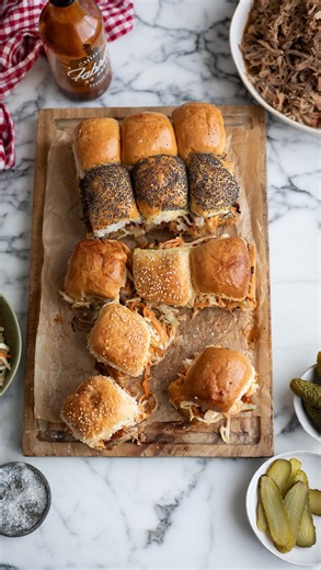 This flavour-packed pulled pork recipe features meat that marinates overnight in a delicious BBQ rub, then cooks in an Instant Pot with ginger beer until it’s fork-tender and easily pulled apart. The cooking liquid is reduced into a delicious, soaking sauce. Use the succulent pork to make sliders that can be crisped up in an Air Fryer or oven. Serve with pickles, coleslaw, and your favourite BBQ or hot sauce for the perfect party snack. Find the recipe on Drizzleanddip.com linked. #recipe | driz