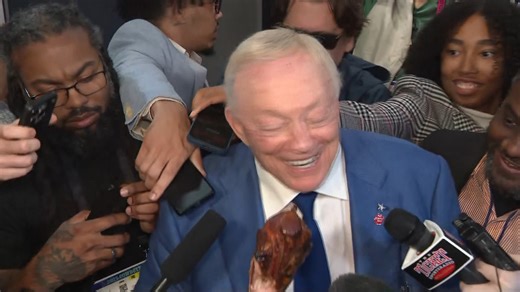 Jerry Jones, turkey leg in hand: "Believe it or not, it tastes pretty good... what a GREAT win on Thanksgiving Day." | Mike Leslie