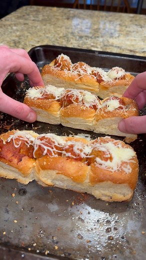 Easy Meatball Slider Subs Cook frozen meatballs according to bag instructions, add marinara sauce Take your Kings Hawaiian rolls, separate them into threes. Scoop the center out of the rolls as shown in the video. Melt butter with garlic powder and some Italian seasoning and brush overtop. Bake these at 350 degrees for 5 minutes After initial 5 minutes, add on your meatballs and top with shredded mozzarella. Bake again at 350 for 15-20 minutes. #recipe #richardeats | Richard Eats
