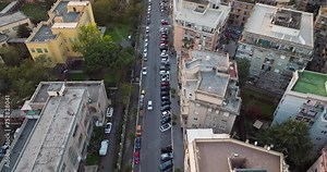 Aerial view of the urban landscape of Rome, Italy. A view of the sleeping areas of the city, cars parked along the historic streets, beautiful architecture. High quality 4k footage
