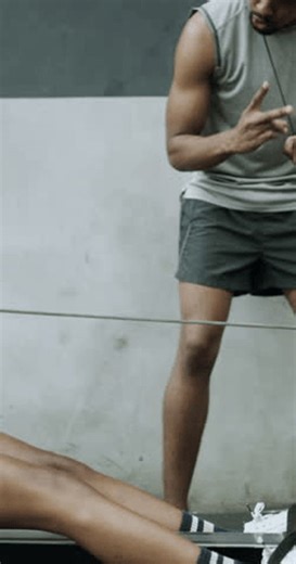 clip-4014155809-woman-exercise-coach-gym-rowing-machine-endurance