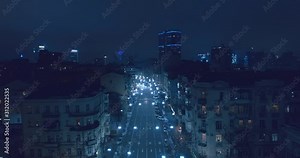 Top down aerial view of night streets in downtown Kyiv, Ukraine, with bright night lighting. Wide shot on dji mavic 2 pro hasselblad camera with smooth cinematic drone motion