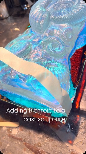 Adding some dichroic glass to an Ammonite Sculpture made of cast glass. Such a pure way to add color to glass is with colored light. The glass is colored by the reflection and refraction “light passing through it” . And it changes multiple colors depending on many things. @jeremysinkus . . . | Jeremy Sinkus Glass Artist