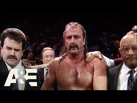 WWE Legends: Jake "The Snake" Displays his Viciousness on Randy Savage & Ricky Steamboat | A&E