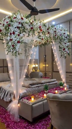 Elegant wedding room setup with soft lighting, fresh flowers, romantic candles, and premium décor accents. Perfect ambience for the bride and groom’s first night. Book your customized wedding room decoration today. #WeddingRoomDecoration #SaqibDecor #BridalRoomSetup #RomanticDecor #WeddingNightDecor | Saqib Flowers SᕼOp wedding planner okara