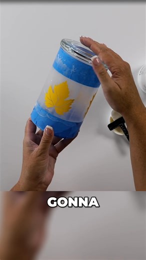 The creator applies etching cream to glass candle holders with a leaf stencil for a unique fall centerpiece. Decorating with a 15-bean mix adds a colorful touch to these DIY home decorations. These etched votives would look great on a mantel or table. #etching #candleholder #fallcrafts #diyhomedecor #glassart #centerpieces #falldecor https://thecraftyblogstalker.com/fall-candle-centerpiece/ | The Crafty Blog Stalker