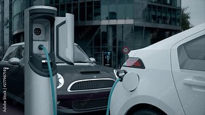 Electric Car Charging At A Charging Station (daytime version, v2)