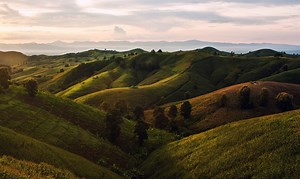 Rolling hills and mountains in Thailand at sunset Rare Gallery wallpaper