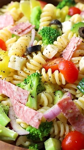 One of my favorite cold salads is this Italian Pasta Salad packed with colorful veggies, such as broccoli, tomatoes, and cucumbers, plus Italian favorites, like salami, cheese, pepperoncini, and olives. | Skinnytaste