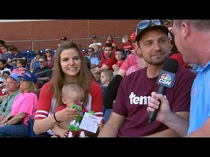 Fan discusses holding baby and catching ball