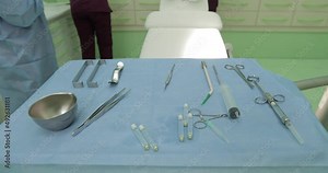 revision of the dental inventory, cleaning of the dentist's instruments, gloved hands taking dental instruments and laying them out on the table, going to the dentist, dentistry, bite, dental treatmen