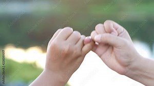 4k close-up, Middle aged couple hands of lovely couple hooking each other's little finger together ,pinky swear, pinky promise concept