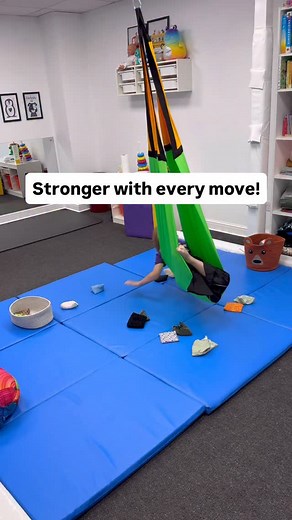 This sensory swing activity has so many therapeutic benefits 👇 🔵Stimulates the vestibular system – swinging and changing body positions help improve balance, spatial awareness, and sensory integration. 🔵Strengthens core and shoulder muscles – while reaching for the bean bags, the child actively stabilises their body, building strength and postural control. 🔵Improves hand–eye coordination and motor planning – the child learns to reach accurately and control movement direction and force. 🔵Pro
