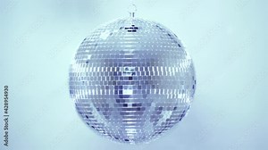 Disco ball. Mirror ball reflects white light. Disco ball with reflected moving rays.