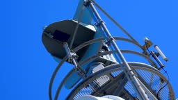 Weather radar with a rotating radiodetection antenna on top of a...