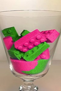 Colorful sand bricks in glass bowl
