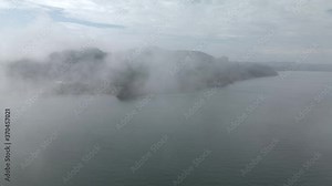 Flying Over The Thick Fog And Revealing The Gaspe Peninsula By The Saint Lawrence Gulf In Quebec, Canada. - aerial drone