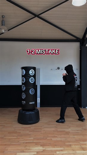 The 1–2 (jab–cross) is boxing’s most fundamental combination—and the backbone of almost every combo in the sport. You throw the jab (1) first to measure distance, blind your opponent’s vision, and disrupt their timing, then immediately follow with the cross (2) straight down the center line while their guard is occupied. The jab sets the trap; the cross closes it. Keep both punches on a straight path, no wind-up, no telegraphing—snap the jab out and back, then drive the cross off the back foot w