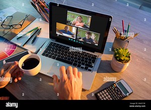 Hands of man using laptop for video call, with waving diverse elementary school pupils on screen. communication technology and online education, digit Stock Photo - Alamy