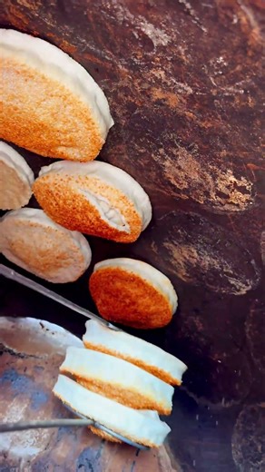 Crispy Gold! Harvesting traditional pit-baked bread.