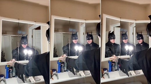 Man in Batman Costume Hilariously Lip-Syncs 'Bohemian Rhapsody' In a Three Way Mirror