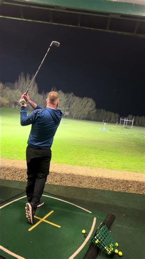 4 iron night time driving range golf ball flights