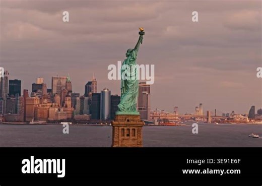 Aerial view of Liberty statue and New York City skyline. Liberty statue above NYC aerial view. Drone view of Liberty statue above New York City. Aerial panorama of New York City with Liberty statue