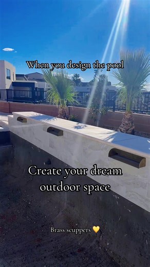 The outdoor pool design was an extension of the home interior in my design. The brass water features are my favorite part- along with the stone. #outdoorliving #pool #brass #outdoordesign