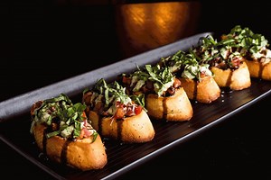 Toasted garlic baguette, tomato, red onion, basil, herbed aioli, balsamic glaze, and parmesan. Is there any better way to enjoy your weekend? Visit https://www.mrmikes.ca/locations/ to make a reservation tonight. | MR MIKES