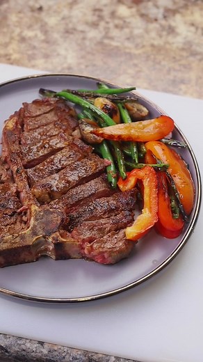 Just at bone steak 🥩 Preheat skillet over medium heat. Lightly brush the steak all over with oil and season generously with salt and pepper. Raise the heat to high, add the steak and cook, turning once, until well browned. It should take about 5 minutes for the first side, and 4 minutes on the second side, cook time depends on how you want it I used garlic butter with rosemary to add flavor to mine 💯 #bonesteak #steak #recipe #cooking