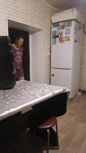 Engaging Dance Moves in a Cozy Kitchen Setting