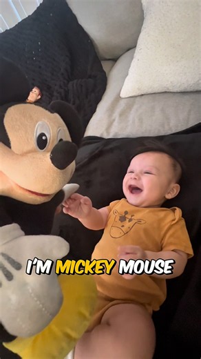 Baby laughing crazy at Mickey Mouse. 🤣