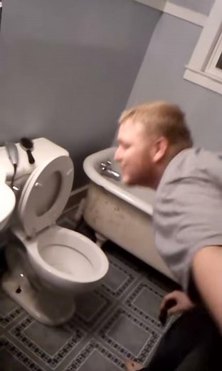 Guy eats turd from toilet