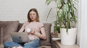 Young adult business woman typing on laptop computer working in internet, beautiful female professional user lady using pc technology doing online job in office or browsing web sit at home table Stock Video